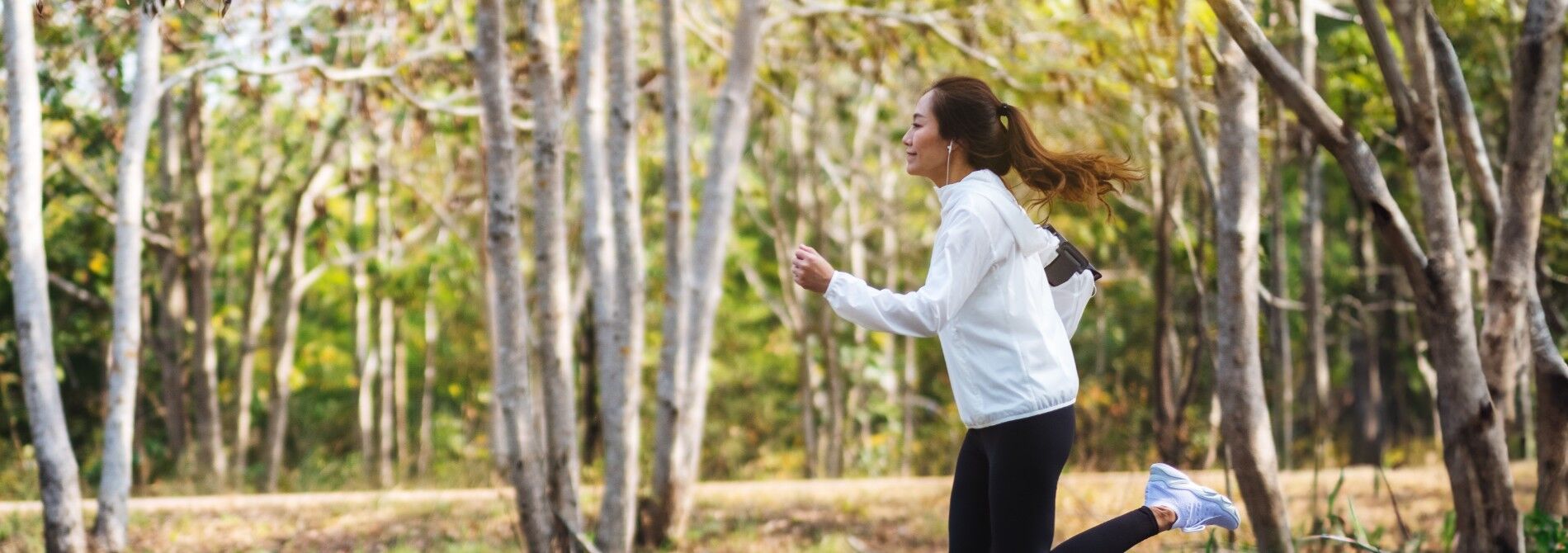 A woman running outside in nature